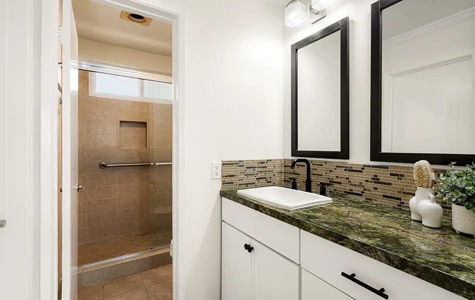 Bathroom vanity and walk-in tile shower in 11550 Nebraska Ave West Los Angeles condo for sale