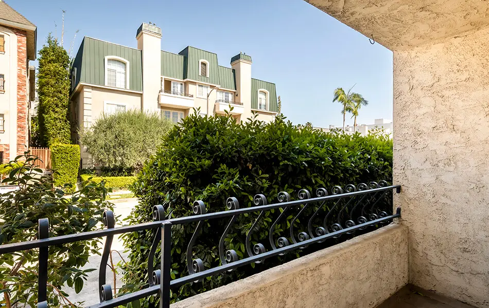 Balcony view of courtyard and landscaping at 11550 Nebraska Ave West LA condo for sale