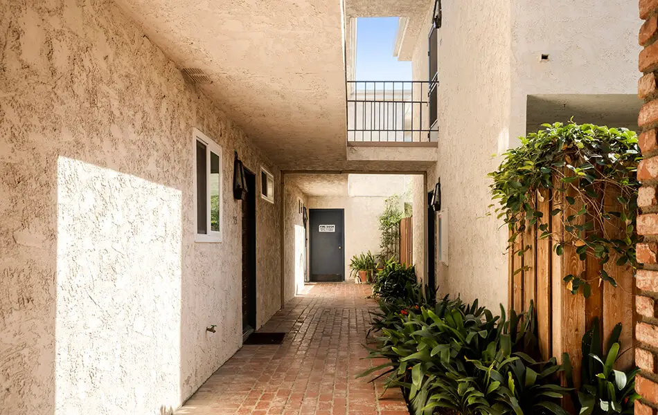 Walkway to unit entrance with brick path at 11550 Nebraska Ave West Los Angeles condo